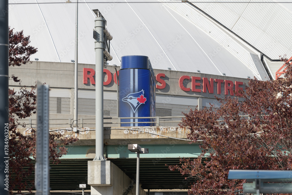 Fototapeta premium compressed view of Rogers Centre Stadium and Toronto Blue Jays logo seen from the waterfront (Queens Quay W)