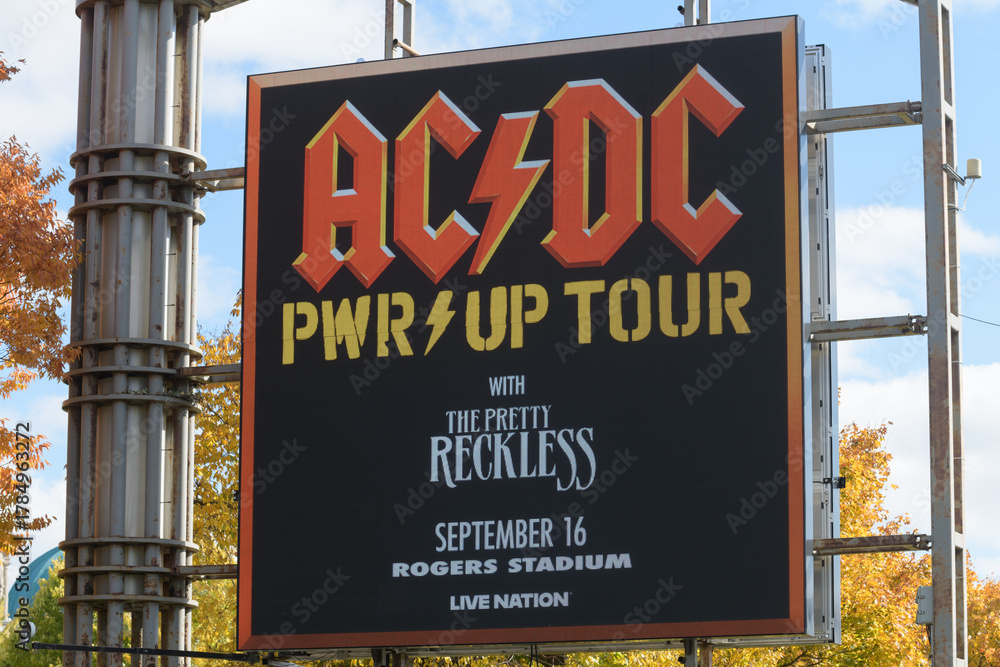 Fototapeta premium Exhibition Place digital roadside billboard featuring a concert promotion for AC/DC PWR/UP Tour (September 16, 2026)
