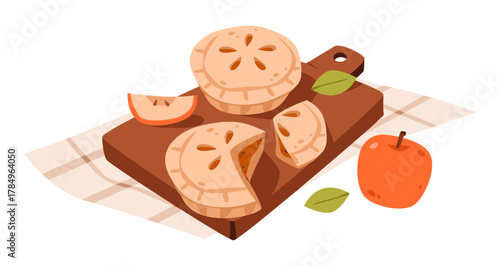 Mini apple pies on wooden board. Freshly baked mini apple pies with golden crusts placed on a wooden cutting board, perfect for autumn designs.