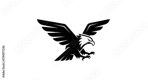 Majestic eagle with outstretched wings in bold black silhouette against a pristine white background