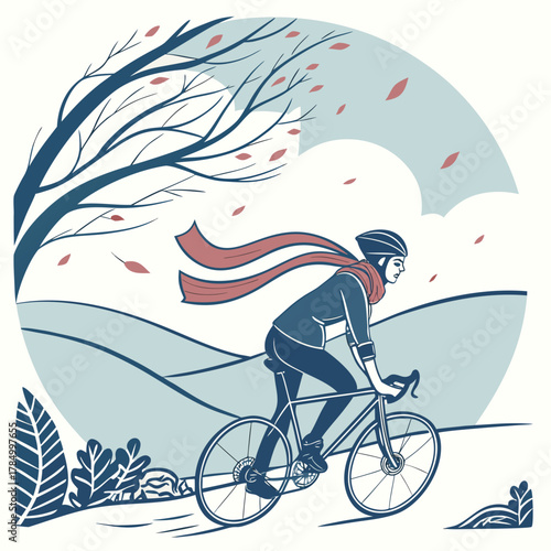A cyclist rides a bicycle on a windy autumn day