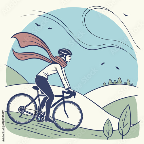 A cyclist rides a bicycle on a windy day