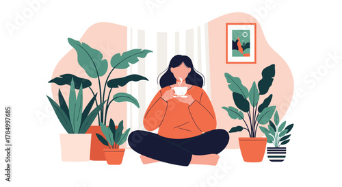 A woman relaxes in a cozy room surrounded by lush green houseplants enjoying a warm beverage.