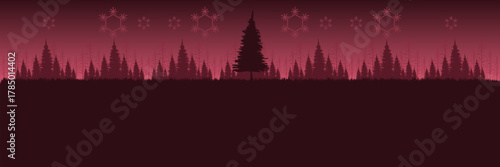 Panoramic Christmas night background with a red forest silhouette snowflakes and large copy space.