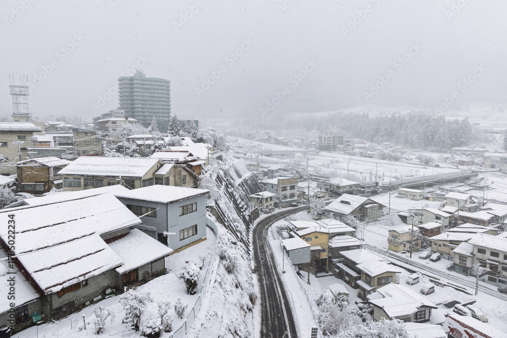 Obraz premium Townscape of town Yudanaka during wintertime in the snow, Nagano region in Japan. Place of Snow monkey park