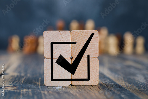 Corporate regulatory and compliance. Goals achievement and business success. Task completion. Ethical corporate. Do the right thing. Quality and ISO symbol. Placing wooden cube with checkmark icon.