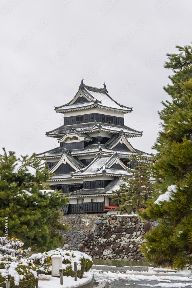 Fototapeta premium Famous Matsumoto castle originally known as Fukashi Castle National treasure of Japan during wintertime in Matsumoto, prefecture Nagano in Japan