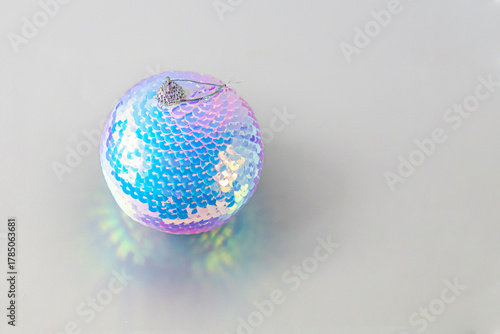 A shiny disco ball ornament with playful reflections