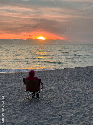 sitting on beach watching sunset