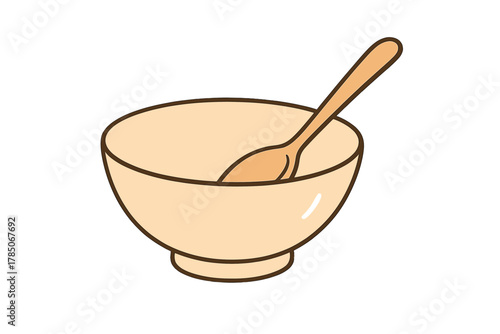 Empty ceramic bowl with wooden spoon resting inside