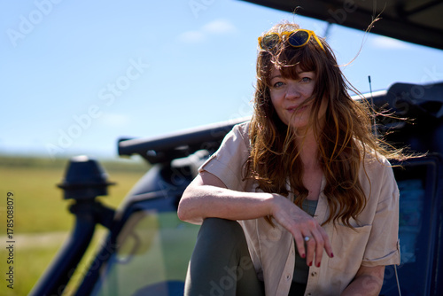 Ginger woman with sunglasses on Safari