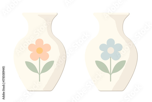 Two ceramic vases with simple pastel flower decorations standing next to each other