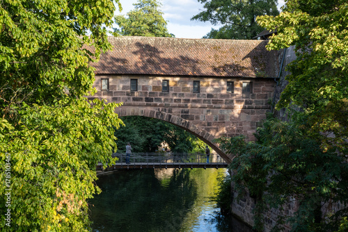 Historic view of Nuremberg, Bavaria, Germany, featuring Kettensteg, Fronveste, Schlayerturm, Grüner Turm, and the charming Hallertürlein tower.
