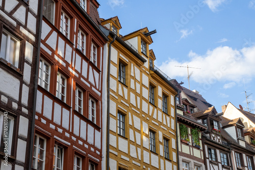 Colorful traditional timber-frame houses along Weißgerbergasse street in Nuremberg, Bavaria, Germany, showcasing charming medieval architecture in a picturesque old-town setting.