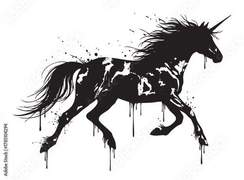 Black silhouette of a unicorn with a flowing mane, dynamically captured with an artistic splatter effect suggesting motion.