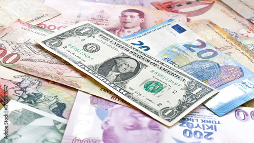Fototapeta Naklejka Na Ścianę i Meble -  Money currencies banknotes. Different banknote Euro Thai Bath Bahraini Dinar Saudi Riyal United States Dollar Turkish Lira background.