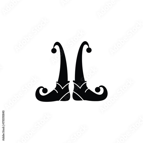 Black silhouette of two pointed elf boots with curled toes and pom poms isolated on transparent background