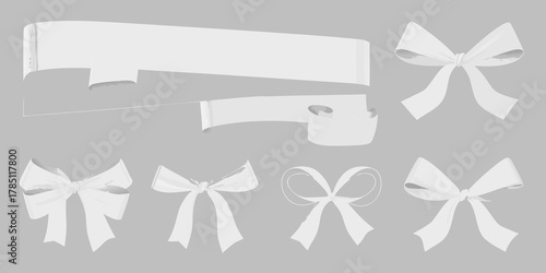 Collection of various white ribbon bows and banner elements on a gray background