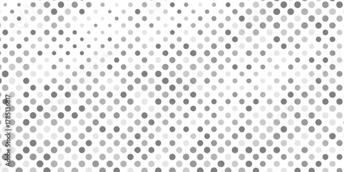 Abstract halftone pattern of varying gray circles on creating artwork featuring overlapping circles of textured pattern background, halftone with mix shades of gray and white dots modern background.