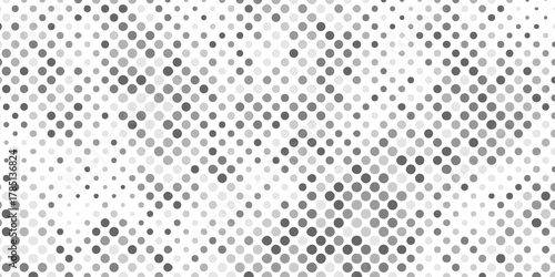 Abstract halftone pattern of varying gray circles on creating artwork featuring overlapping circles of textured pattern background, halftone with mix shades of gray and white dots modern background.
