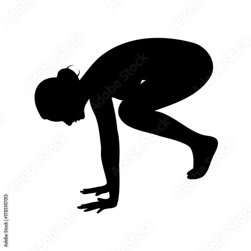 Black Silhouette of a Woman in Crane Pose Demonstrating Yoga Practice