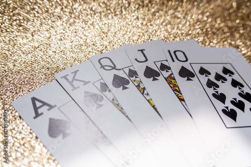 Photograph of a set of cards that make a winning hand, a Royal Flush