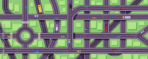 Top view of a city road junction with cars, markings, and buildings.