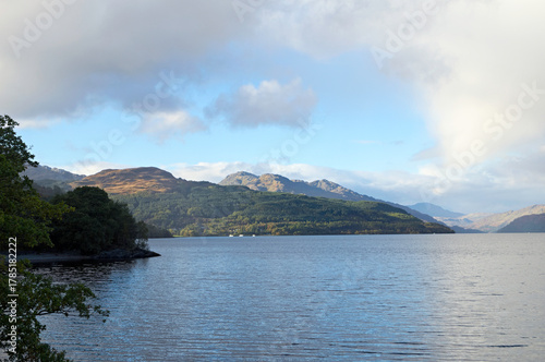 Evening view north up the loch past Cruach Tairbeirt to Ben Vorlich from Firkin Point, a viewpoint off the A82 on the west shore of Loch Lomond, OS map ref NN 338 007, Argyll and Bute, Scotland.