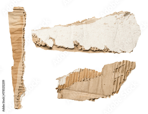 Torn corrugated cardboard pieces isolated on white