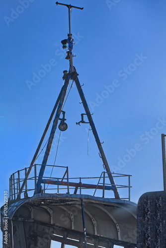 Rusty remains of the tripod foremast, still retaining some paint and colonized by cobwebs, of the Golden Harvest shipwreck. Fort William-Scotland-059