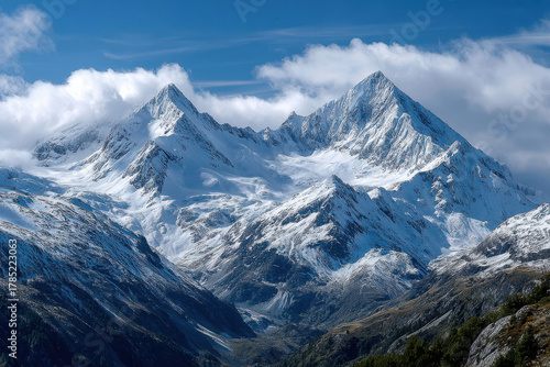 Wallpaper Mural Snowy Mountain Peaks Under a Blue Sky with Clouds Torontodigital.ca