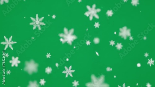 Wallpaper Mural Delicate snowflakes falling gently against a vibrant green background creates a stunning holiday atmosphere perfect for winter promotions Torontodigital.ca