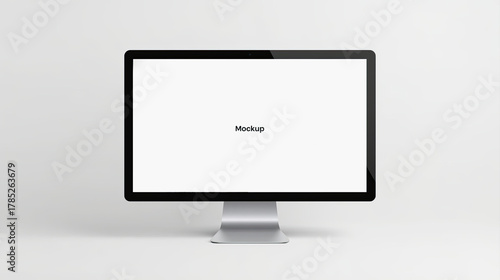 A computer monitor with a silver base displays the word 