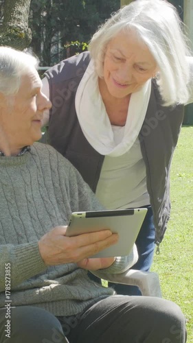 Happy elderly people spending time together outdoor. Vertical Video