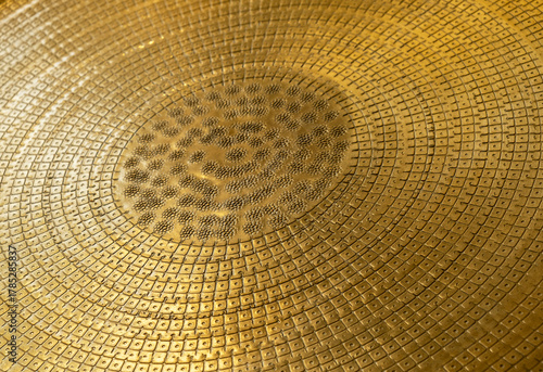 Close up of textured golden brass surface pattern