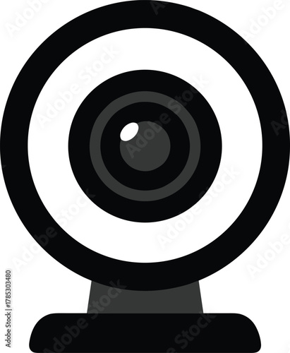 Minimalist black and white webcam icon, circular lens with reflective highlight, concentric camera rings, trapezoidal base mount, video communication and streaming symbol