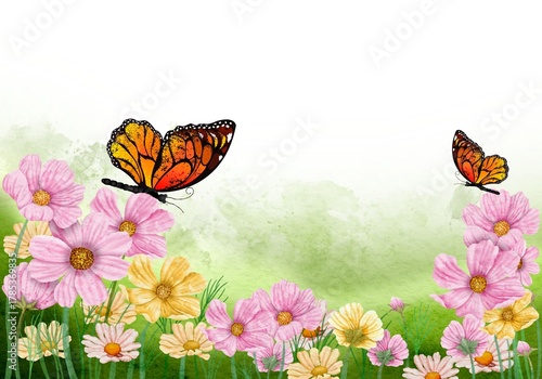 Colorful butterflies flying over blooming spring flowers in green garden background