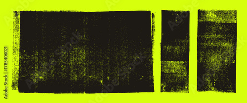 Grunge linocut stamp textures set on bright yellow-green background. Ink rollers, black smudges.
