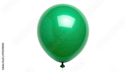 Shiny, green balloon against a stark black background