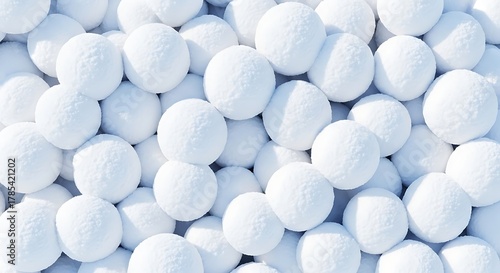 Pile of fresh snowballs creates a winter wonderland background for seasonal designs and holiday promotions
