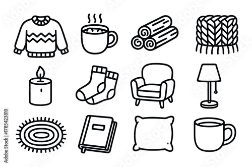 Cozy home elements: sweater, coffee, blanket, candle, socks, chair, lamp, rug, book, pillow