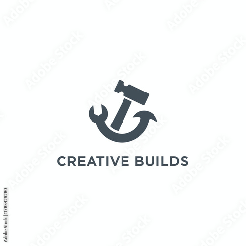 A construction-themed logo, featuring a hammer, wrench, and crescent shape against a white background