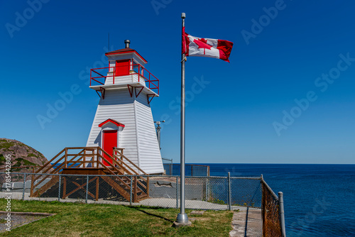The Canadian flag flying at the Fort Amherst Lighthouse in St. Johns, Newfoundland