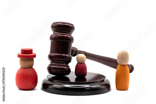 A conceptual story about a family divorce or alimony payments with a judge's gavel and symbolic figures of people