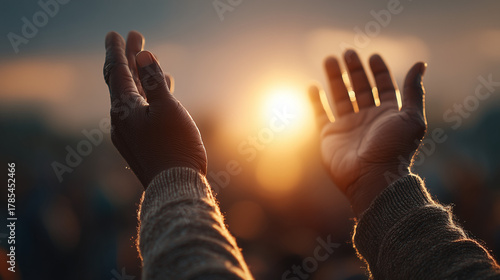 Hands raised in prayer during Ramadan evening