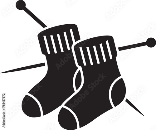 Pair of knitted socks on knitting needles silhouette