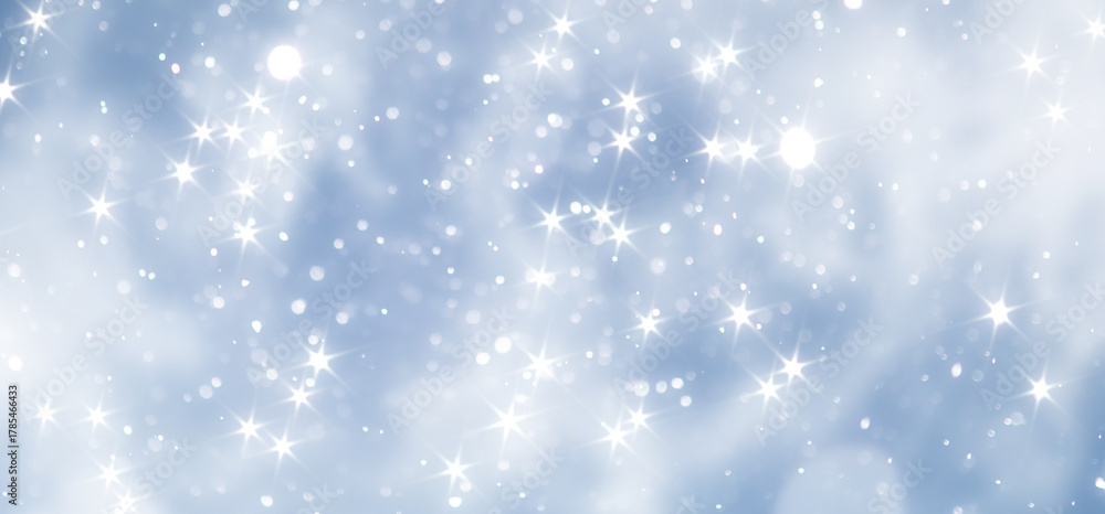 Fototapeta premium blue snowfall bokeh background, abstract snowflake background on blurred abstract blue