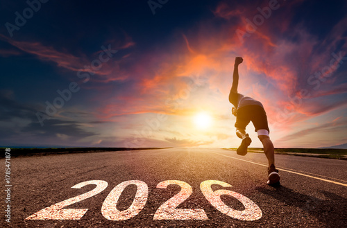 Happy new year 2026 concept.man running and sprinting on road with sunset background