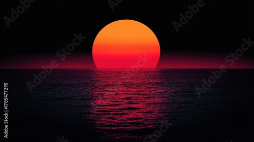 Fototapeta Naklejka Na Ścianę i Meble -  A dramatic sunset over a dark ocean view