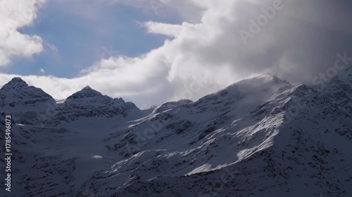 A majestic and dramatic view of the snow capped peaks of Mount Elbrus, the highest mountain in Russia and Europe, located in the North Caucasus region.